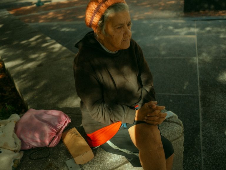 Woman holding her knee while managing knee arthritis pain