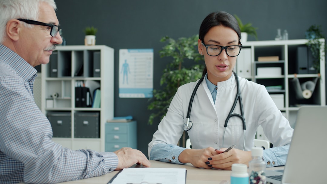 Patient talking with a doctor about non-surgical knee pain treatment options